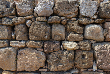 Eroded stone wall as background, Ruines Empuries, Girona, Catalonia, Spain