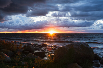 Estonian seascape during a storm at sunset in autumn.