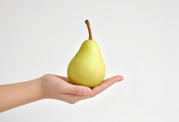 Hand holding a pear on a white background