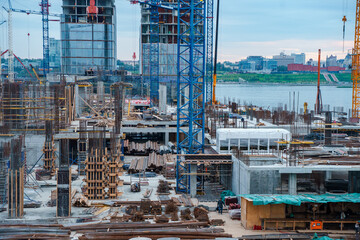 Construction of multi-storey buildings with cranes. Kazan, Russia - 15 Aug 2024