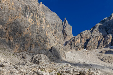 Sunny day in the Dolomites. Rocky mountain peaks of Dolomiti Alps in summer under the blue sky with...