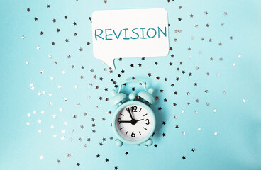 Clock with the word revision written above it