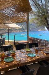 Mediterranean Sea restaurant beach club view resort vacation sunshine yachts boats luxury lifestyle Mallorca Spain Eating Dining Plates Ocean View, Island © Georgia