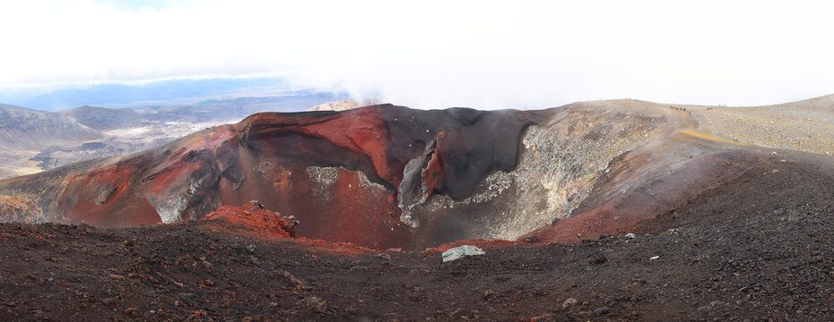Panorama of the Red Crater on the Tongariro Alpine Crossing in the Tongariro National Park, New Zealand. The iconic geological vertical dyke and basalt scoria features are visible from the front.