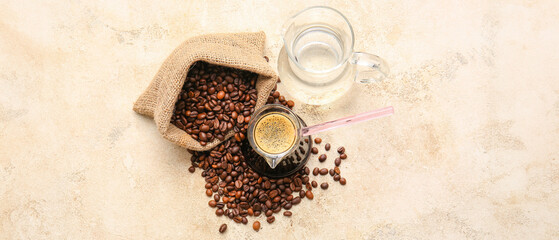 Turkish coffee in cezve and beans on grunge background