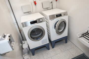 Modern washing machines in laundry room