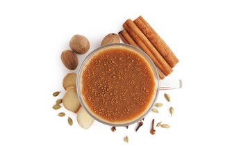Glass cup of tasty masala tea with different spices on white background