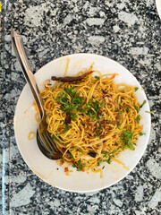Noodles served in a plate, also known as chowmein.
