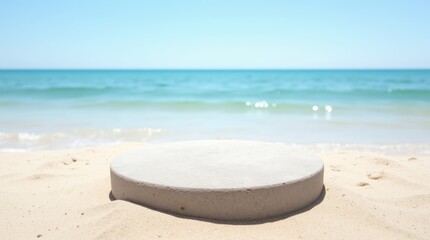 Round Stone Podium on Sandy Seashore
