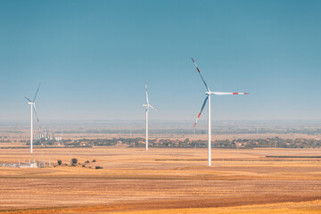 Wind turbine standing tall in a field in Serbia, symbolizing the shift towards renewable energy and sustainable agricultural practices