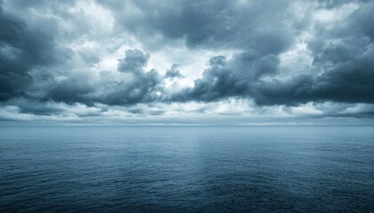 Obraz premium Dark Storm Clouds Above a Still Ocean