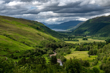 Obraz premium Corrieshalloch Gorge National Nature Reserve With River Through Pasture Valley And Loch Broom In Scotland, UK