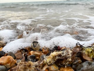 wave on the beach with stones