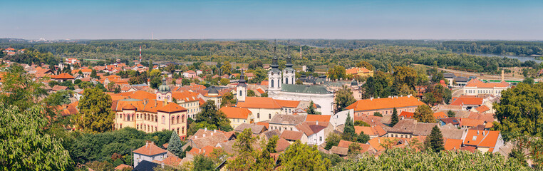 A panoramic aerial view of Sremski Karlovci highlights the stunning summer landscape, with its unique heritage and vibrant urban center nestled in Vojvodina, Serbia