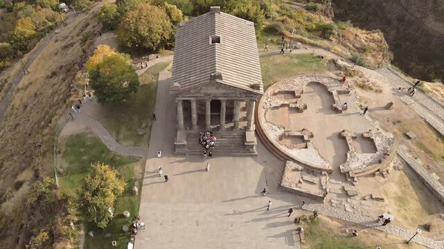 Garni , Kotayk , Armenia - 16th october, 2024: Tourists visit Greco-Roman Garni Temple, aerial static panoramic view