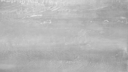 A grey wall with a white line. The wall is made of concrete. The wall is very dirty