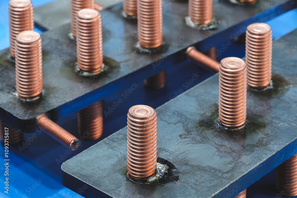 Poster a row of metal screws with a blue background. the screws are all different sizes. some are larger th