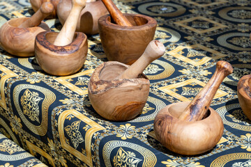 Craft works on table, olive tree wooden kitchen utensils on weekly farmers market in Provence, France