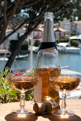 Summer party, French brut rose champagne sparkling wine in coupe glasses in yacht harbour of Port Grimaud near Saint-Tropez, French Riviera vacation, Var, France
