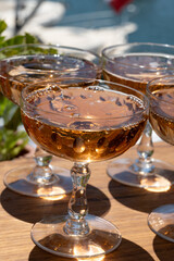 Summer party, French brut rose champagne sparkling wine in coupe glasses in yacht harbour of Port Grimaud near Saint-Tropez, French Riviera vacation, Var, France
