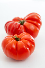 Sweet tasty ripe red french tomatoes from Brittany, France, salad seasonal vegetables