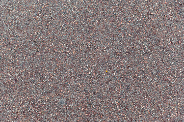 Fragment of the surface of an asphalt footpath. For use as abstract backgrounds and textures.
