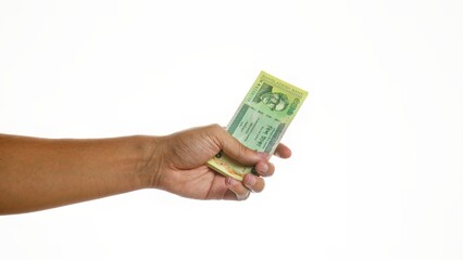 Hand holding bangladesh taka over isolated white background, showing male grip on currency, emphasizing financial concepts.