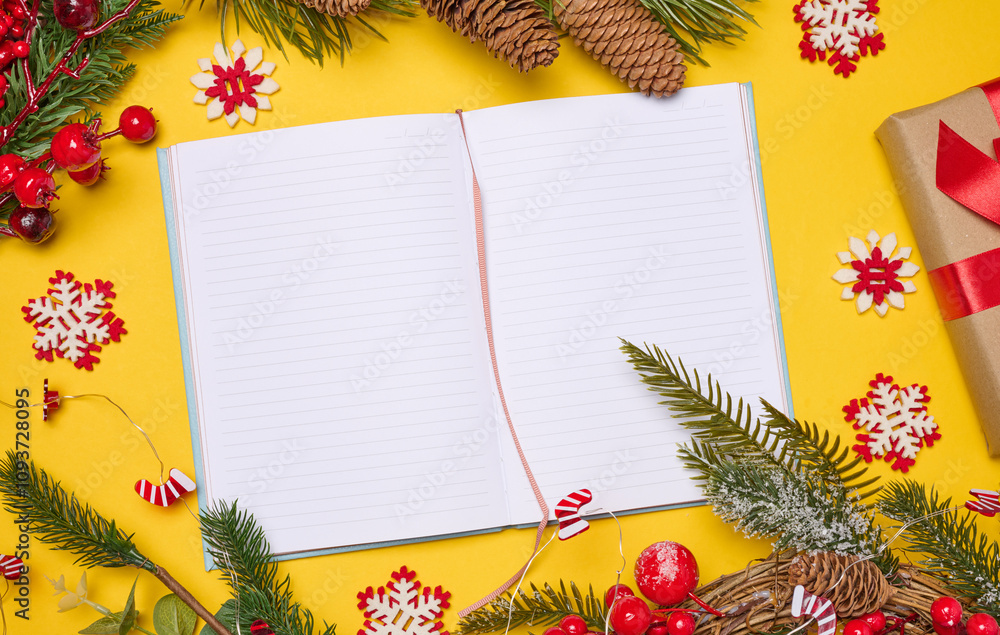 Aufkleber open notebook with empty blank sheets on yellow background with christmas decor