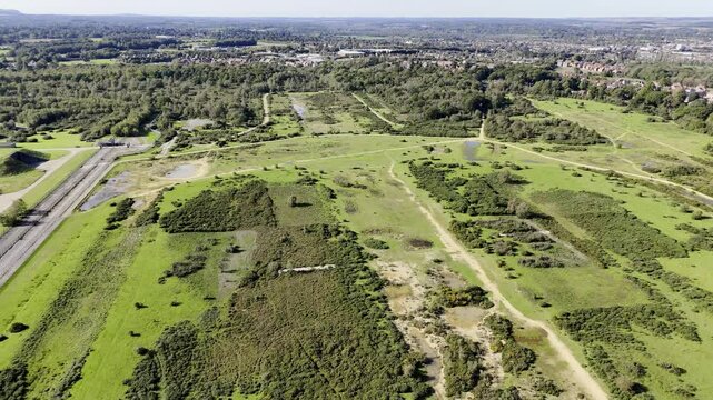 An Aerial Pan across Greenham Common towards the GAMA Ex Nuclear Bunkers, Newbury in Berkshire England