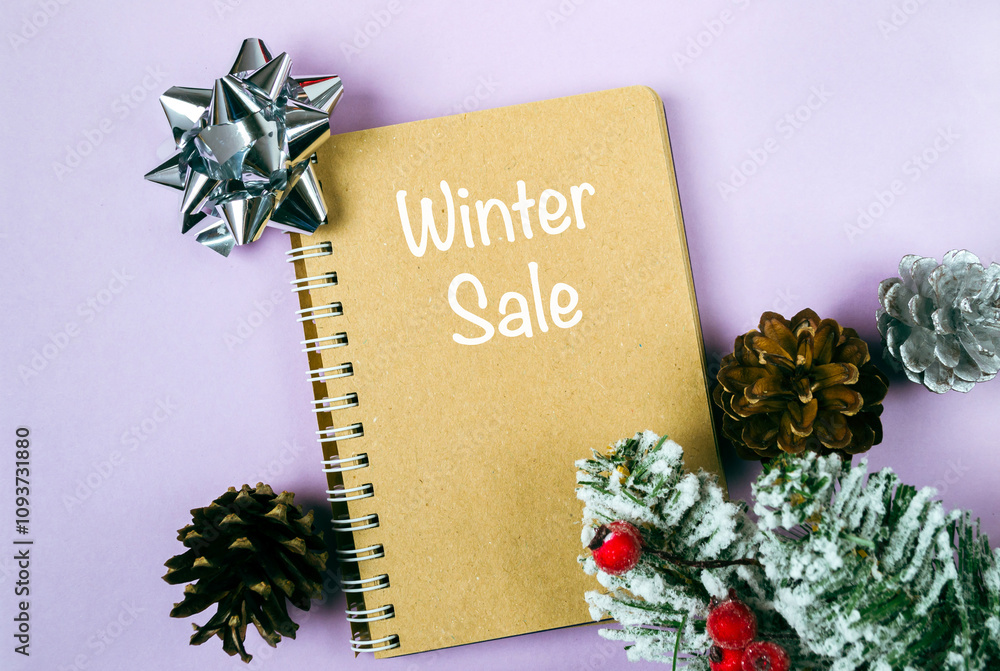 Poster notebook with a christmas tree on top of it