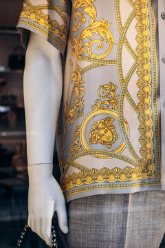 Milan, Italy - August 20, 2024: A close-up of a Versace shirt in a boutique window on Milan's famous shopping street Montenapoleone