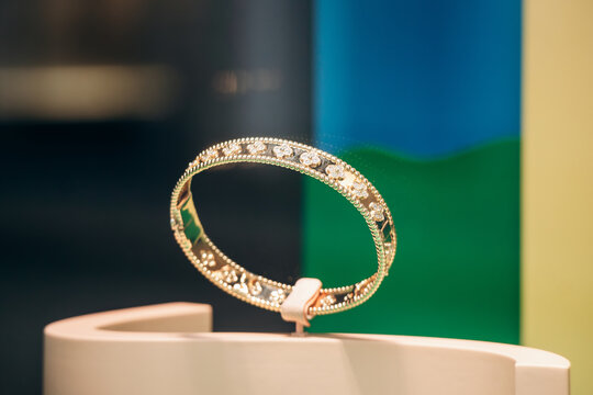 Milan, Italy - August 20, 2024: Van Cleef and Arpels bracelet in the window display on the famous shopping street Montenapoleone in Milan