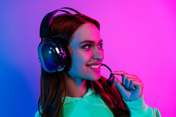 Photo of charming positive woman wear green sweatshirt headphones talking mic isolated neon blue color background