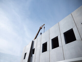 prefabricated building under construction with crane building development
