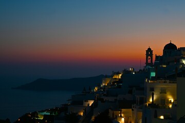 Santorini Greece famous Oia in sunset time golden hour. Santorini island, Greece.