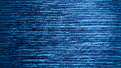 Blue denim fabric background with a soft texture and detailed weave, perfect for fashion design projects.