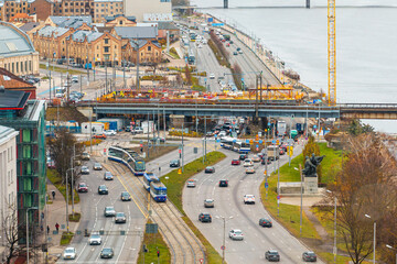 Aerial View of Riga's Urban Landscape with Road Intersection and Bridge