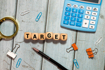 A wooden board with a bunch of wooden letters scattered around it.