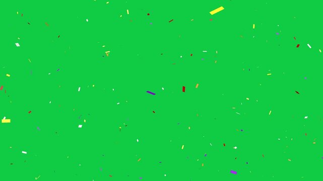 Confetti over green screen. Celebration of ticker tape being dropped. Editing or compositing chroma key overlay.
