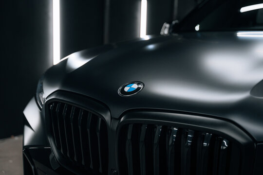 Photo of Black suv BMW X5 G05 xDrive. The photo shows the car in the detailing studio. Complete work on the car polishing and applying a ceramic coating. Marketing advertisements or press articles.