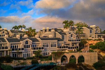 Sunset over luxury homes in Dana Point harbor, Orange County in Southern California on a cloudy day