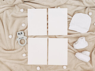 Fototapeta premium Adorable Baby-Themed Mockup with Blank Cards, White Onesie, Fluffy Blanket, and 'Love' Prop – Perfect for Newborn Announcements or Baby Shower Invitations