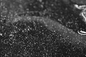 Macro shot of tiny particles in tap water