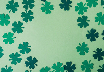 Green background with a large green clover in the center