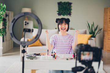 Photo of adorable lucky lady wear violet striped t-shirt recording beauty video modern device indoors room home house