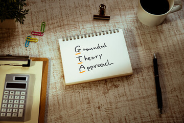 There is notebook with the word Grounded Theory Approach. It is as an eye-catching image.
