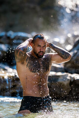 Fototapeta premium Sexy naked man with nude muscular body. Strong athletic shirtless man outdoor. Millennial caucasian Fit male model. Healthy handsome Athletic Man. Muscular man outdoor. Guy showing muscular fit body.