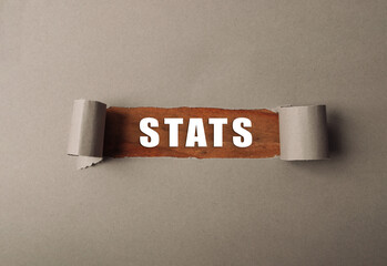 Torn piece of paper with the word stats written on it