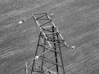 High -voltage transmission lines with a metal rusty fastening suspension system of wires and...