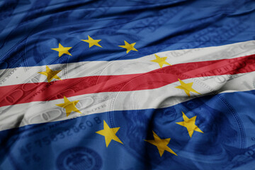 waving colorful flag of cape verde on the dollar money background. finance concept.